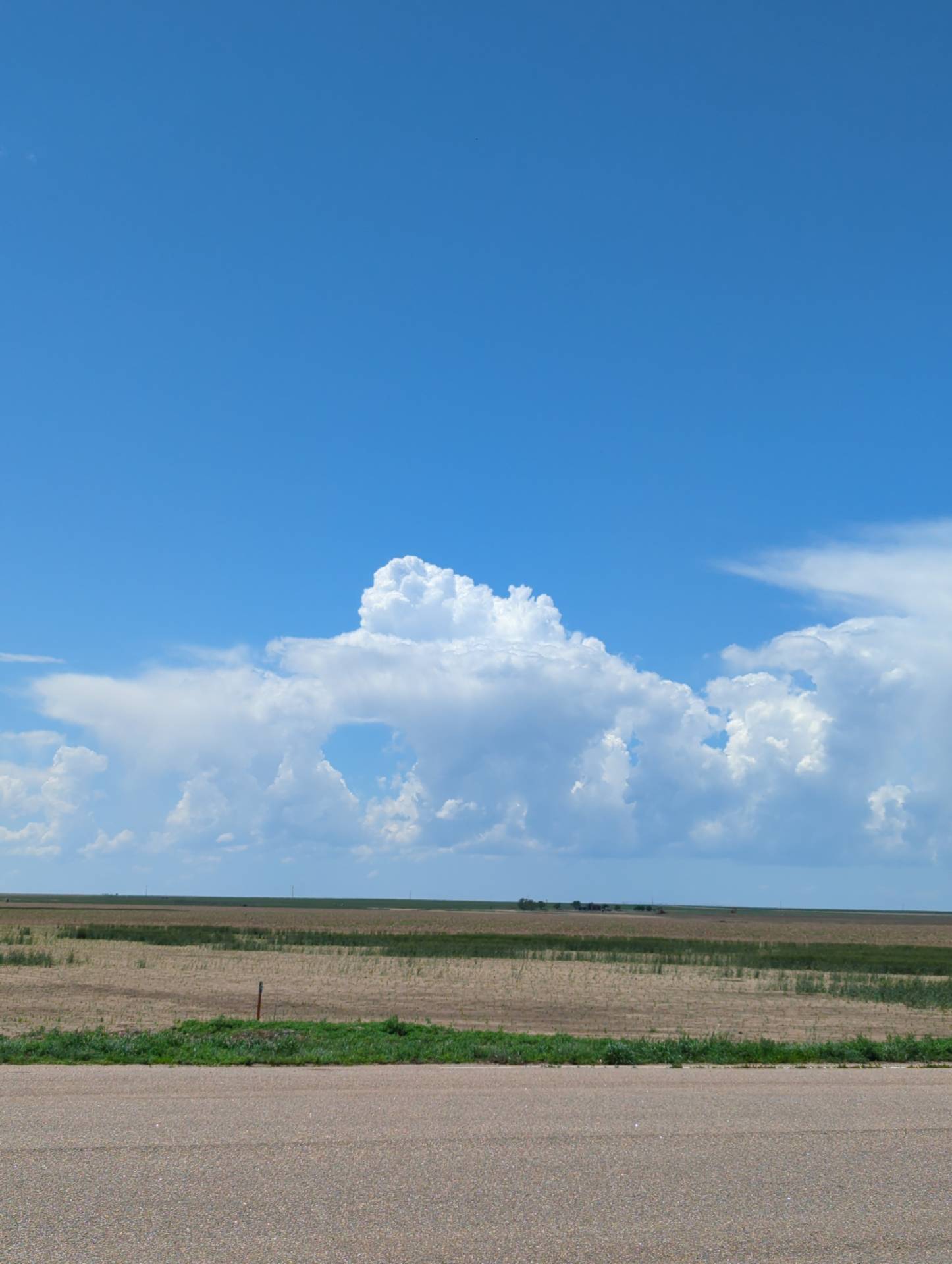 Storms attempting to develop west of Johnson City, Kansas.