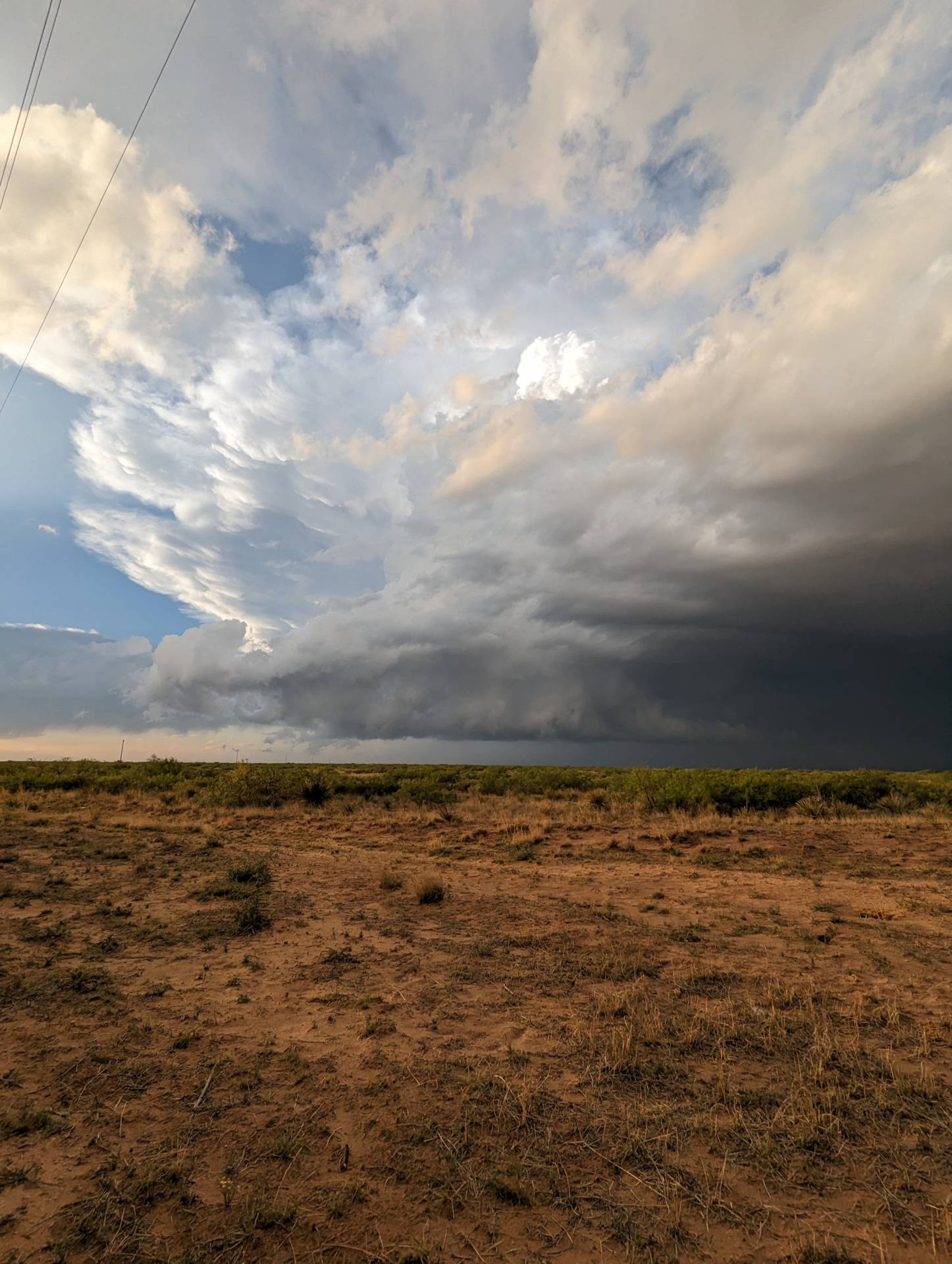 Decaying storm at sunset near Fort Sumner, New Mexico.