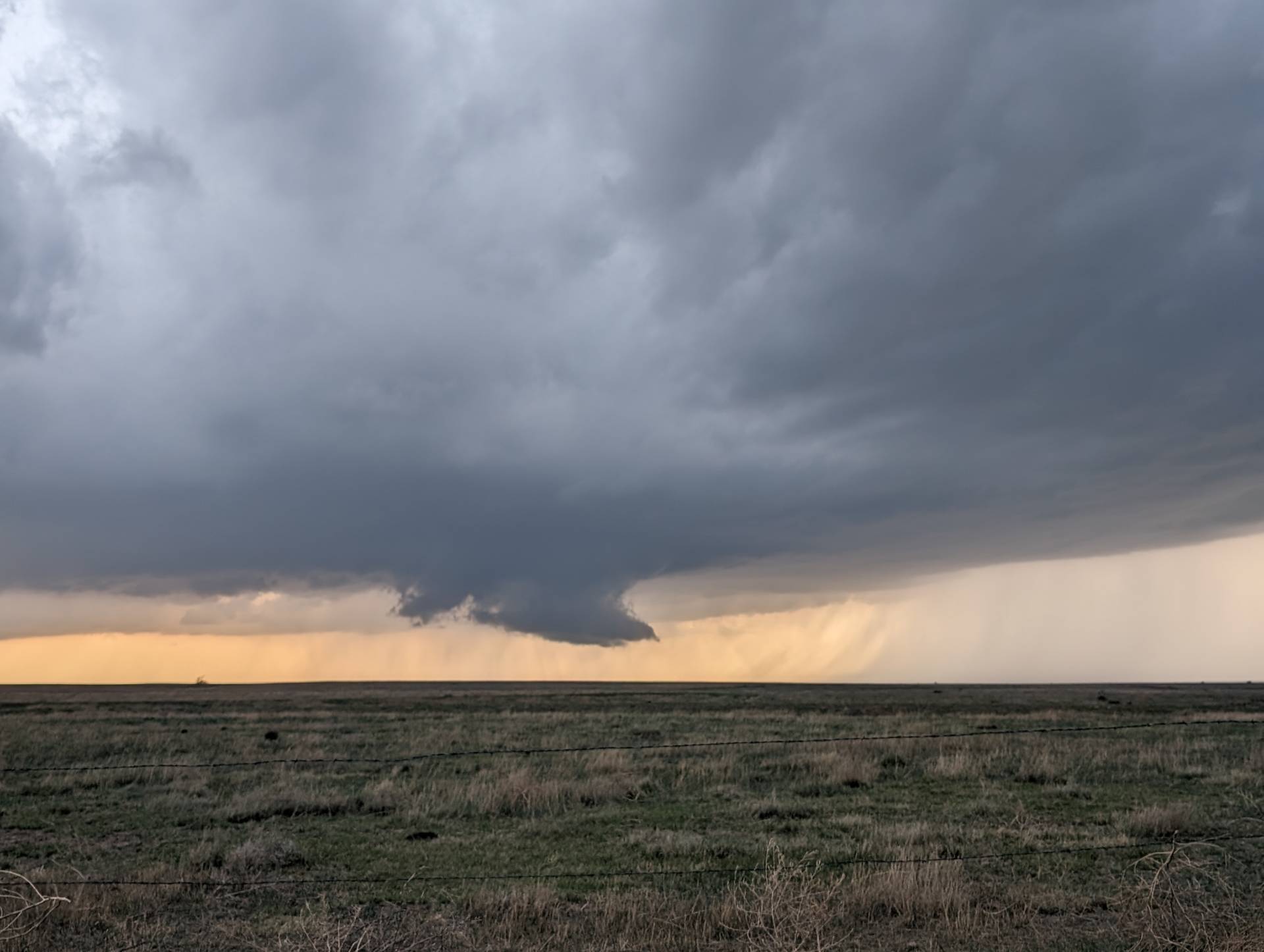 Big beefy rotating wall cloud to the northwest of Healy, Kansas.  Live stream at live.highwaysandhailstones.com #kswx @NWSGoodland